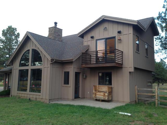 This Gorgeous Retreat has a Fabulous Open concept floor plan along with million dollar views of the San Francisco Peaks. The home boasts Beautiful vaulted tongue & groove ceilings, a rock feature wall with a Heatilator Wood Stove, Unique Industrial custom metal trim & railings, concrete floors, custom light fixtures and a $30,000 sound system.