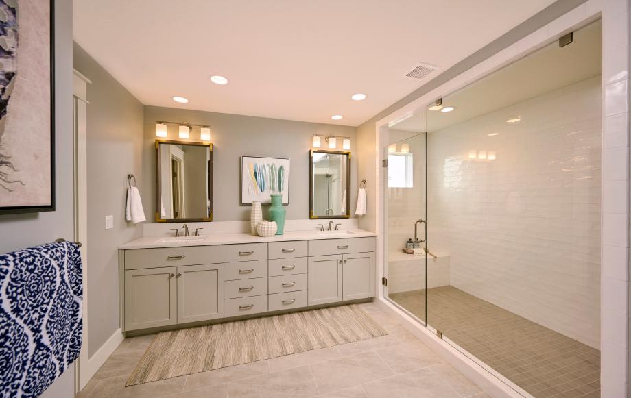 Full-tiled luxury shower and dual sink vanity