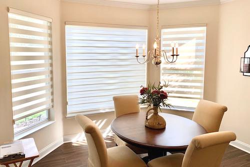 We love the way these sheer shades brighten up this dining room! These shades are cordless and can come motorized allowing for effortless light control, while giving the room a lavish glow.