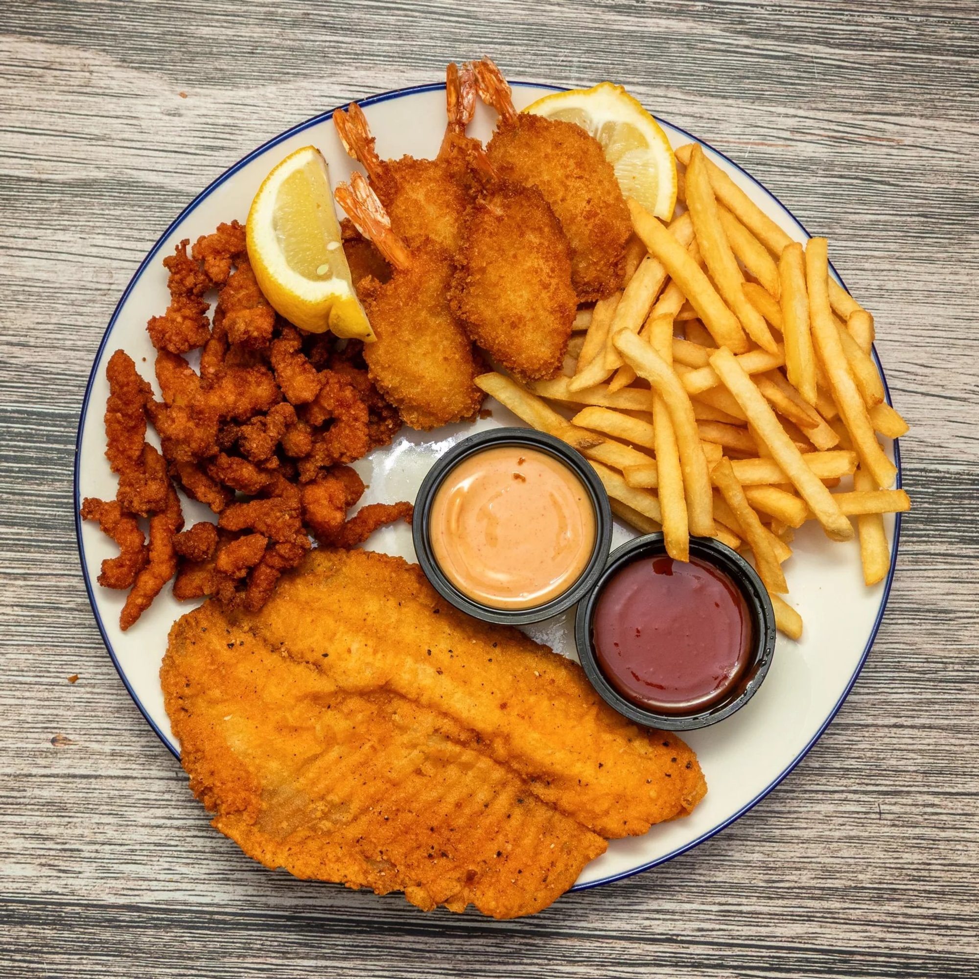 28. Combo Sea Food- 1 Pc Fish, 6 Pcs  Jumbo Shrimp, 6 Pcs of Clam Strips with Fries