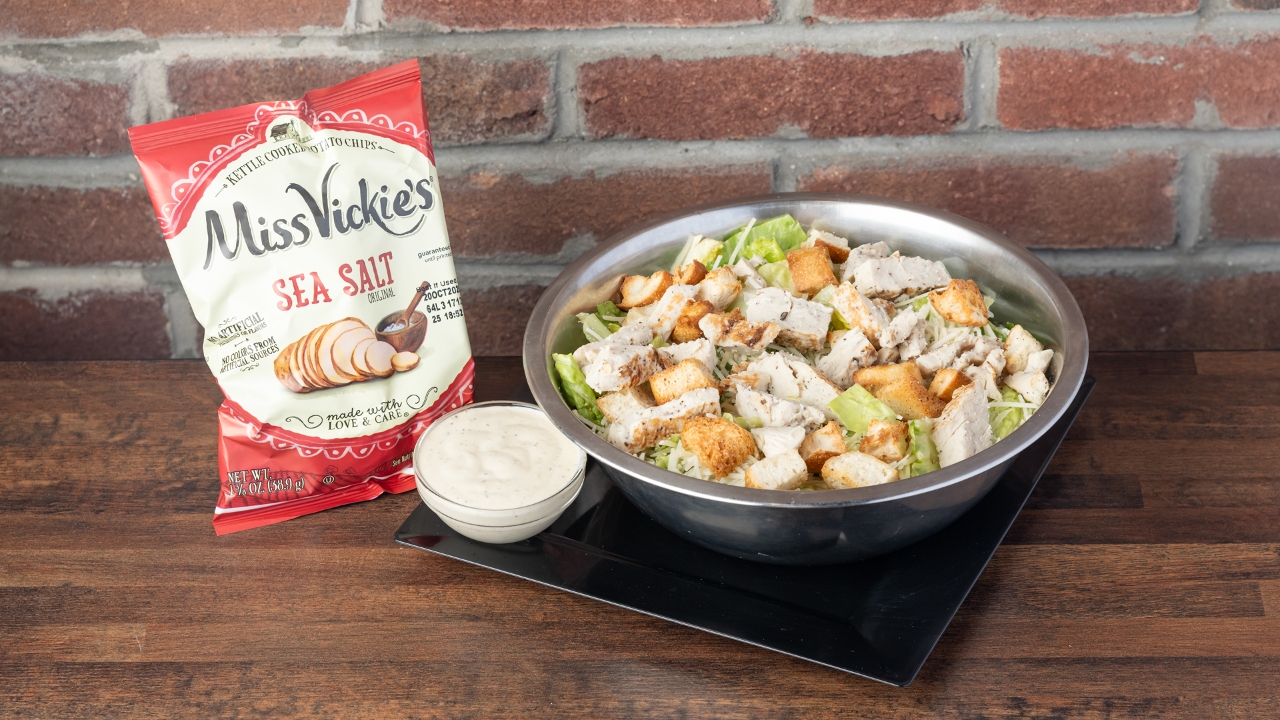 Chicken Caesar salad with chips