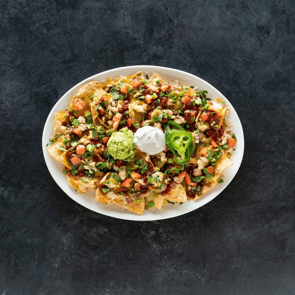 Enjoy a variety of appetizers, like our Chicken Nachos, while watching your favorite sports games.