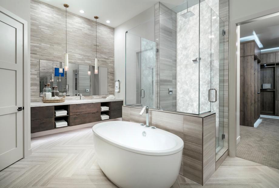 Lavish primary bathrooms with walk-in shower, and freestanding soaking tub