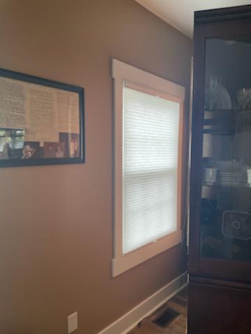 In a room full of antiques and heirlooms, it's best to keep the sunshine low and prevent UV damage. Here in this Russellville home, our Cellular Shades are accomplishing that job beautifully!