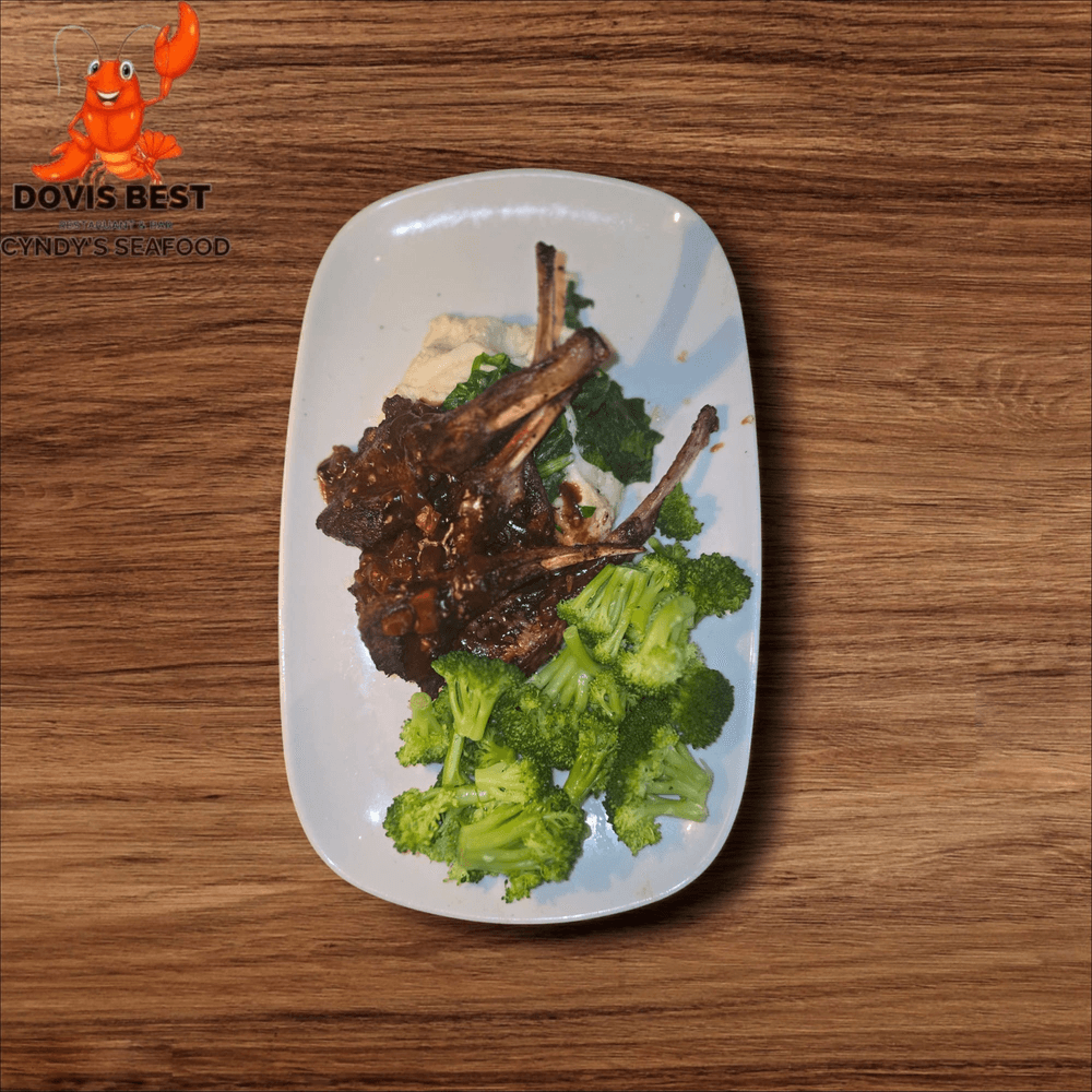 Grilled Lamb Chop with Jollof Rice and Sauteed Broccoli or Asparagus or Collard Green or Spinach