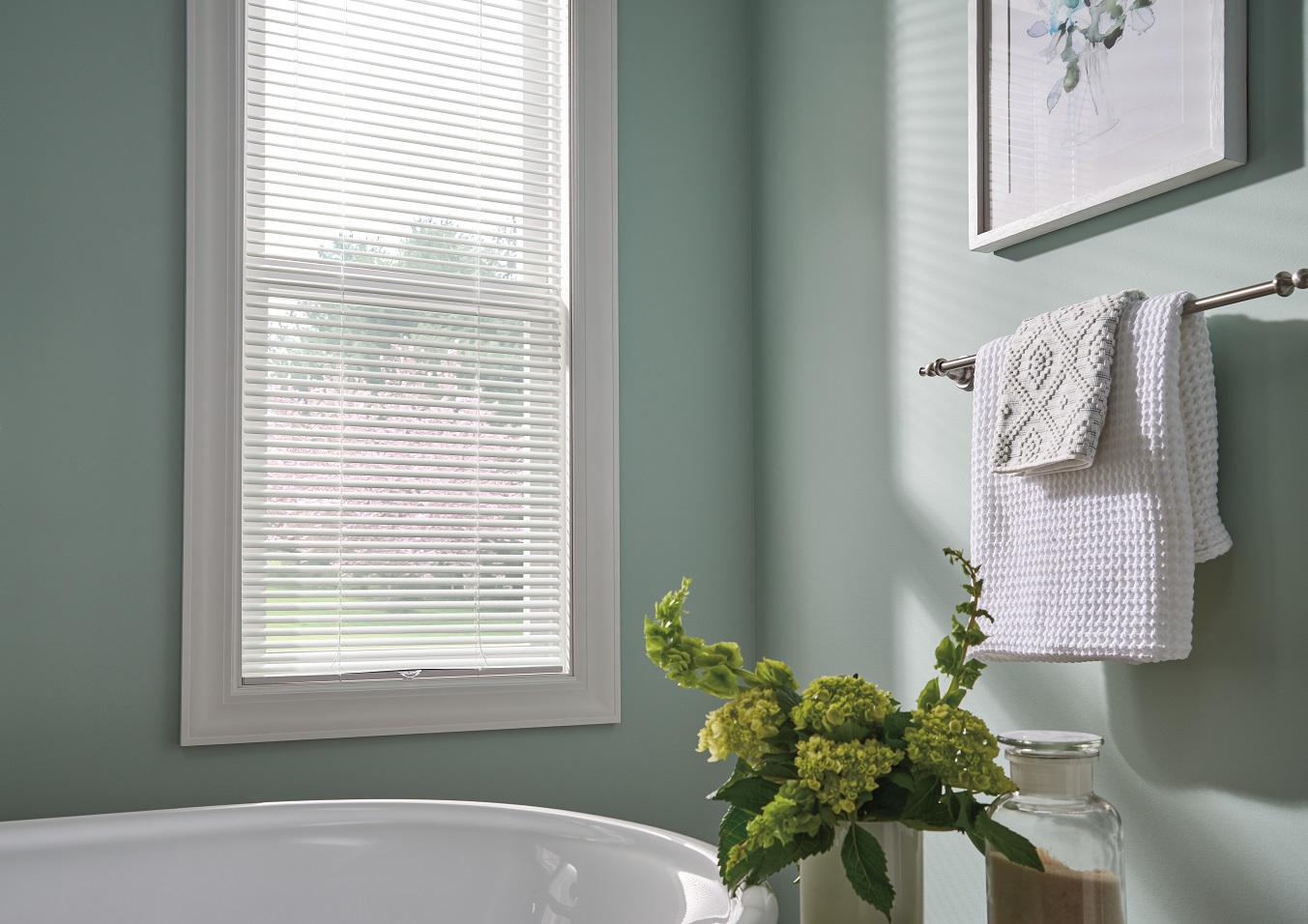 Beautiful bathrooms deserve beautiful blinds. Get a polished look that holds up in moist conditions and offers the privacy you need with these stylish Aluminum Blinds.  BudgetBlindsOfOwasso  AluminumBlinds  MoistureResistantBlinds  BlindedByBeauty  FreeConsultation  WindowWednesday