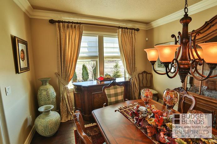 Create a homey feel with Custom Draperies and Roman Shades in your dining room, like this one in Boise, ID. We can smell grandma's cooking from here!  BudgetBlindsBoise  CustomDraperies  RomanShades  FreeConsultation  WindowWednesday