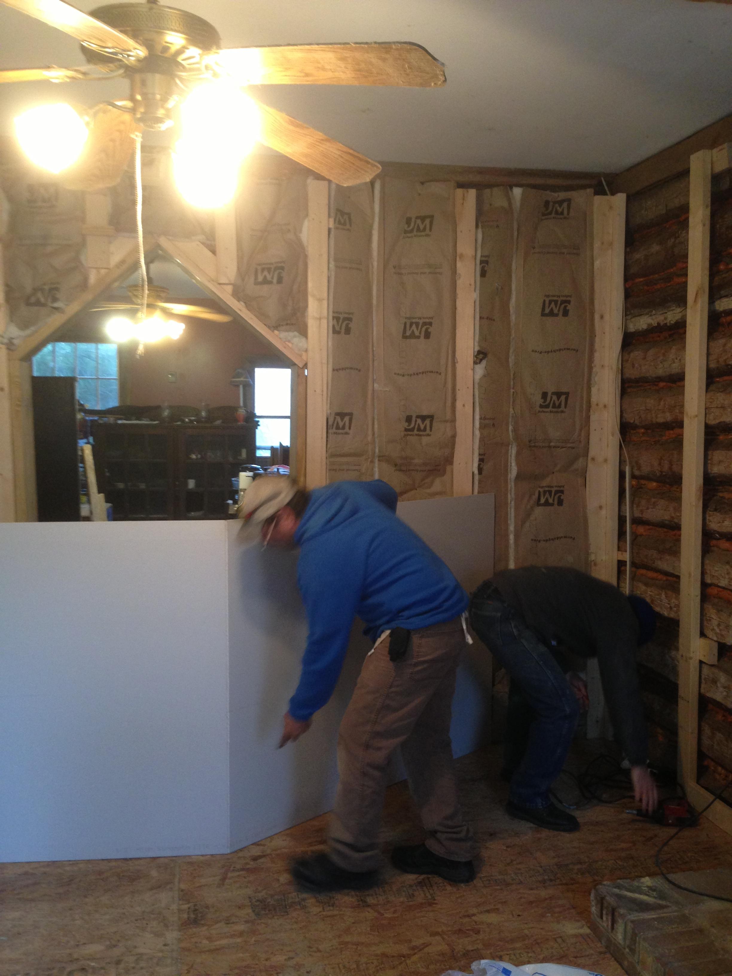 The Paladin Crew hard at work making renovations to a log cabin. 