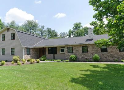 Sprawling 5 Bedroom,  3.5 Bath home on 2 acres. Great entertaining home. Sun Room overlooking blue stone patio. 