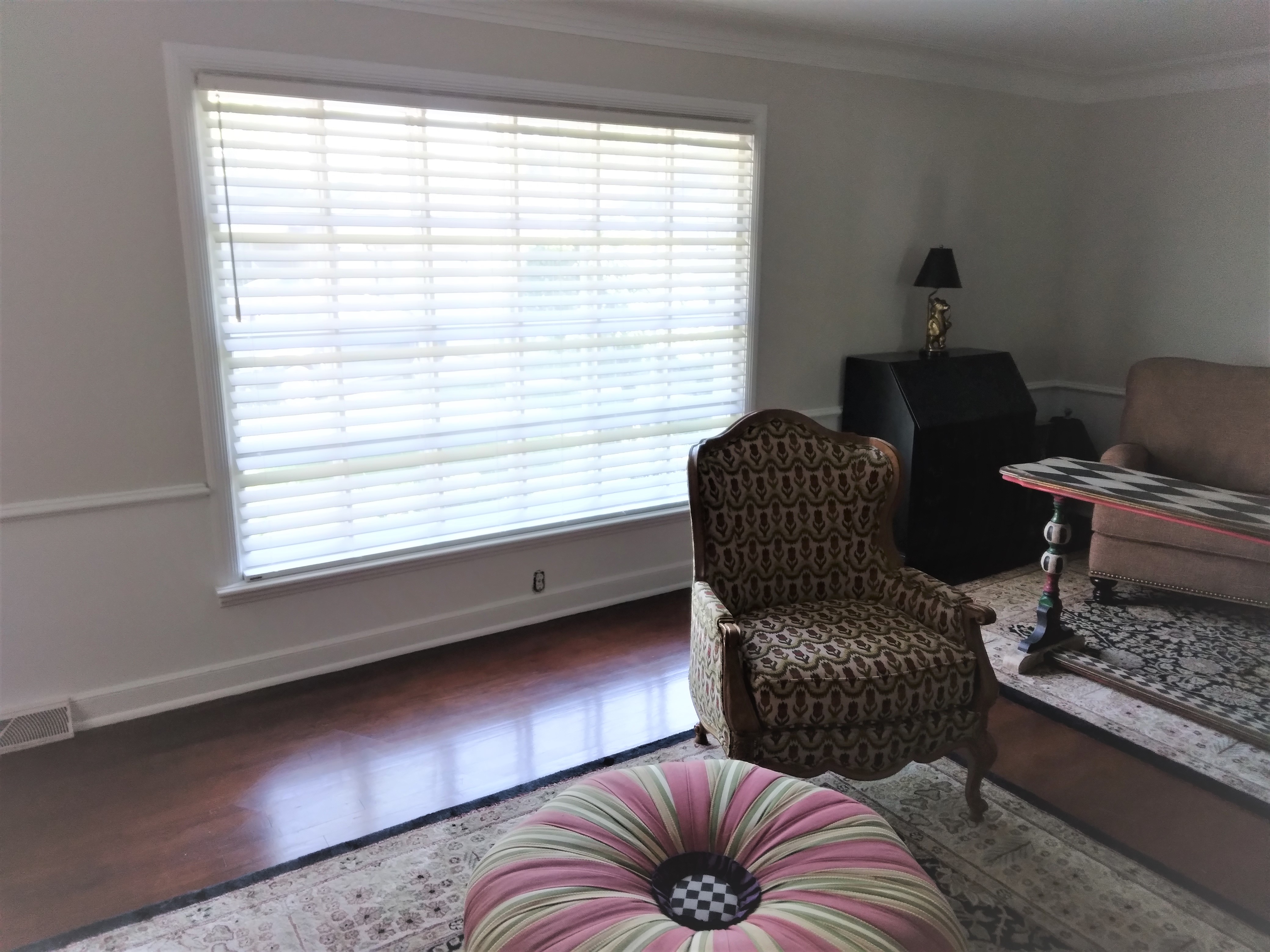 White faux wood blind in Springfield Illinois living room.  BudgetBlinds  Window Coverings  Blinds  SpringfieldIllinois
