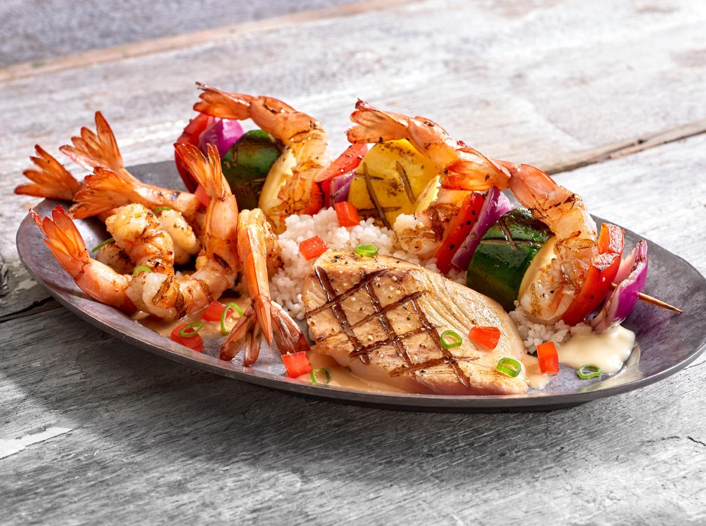 A trio of our most popular grilled seafood... Shrimp & Veggie Skewer, Shrimp New Orleans and our Bourbon Street Mahi Mahi.