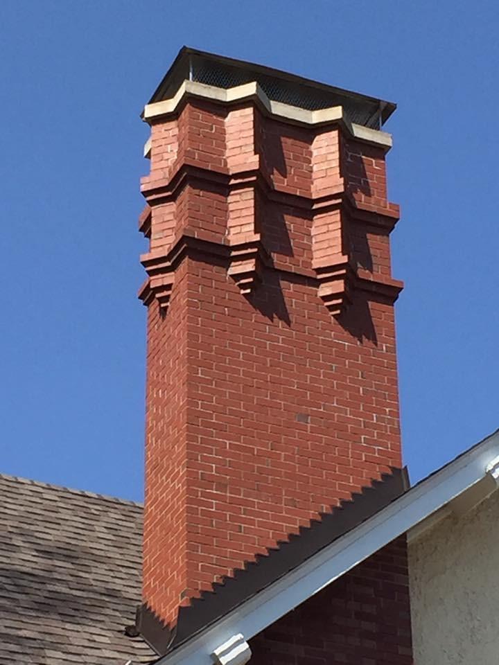 Rebuilt to original specification intermingling existing  brick with new brick matching original mortar joints and color.
