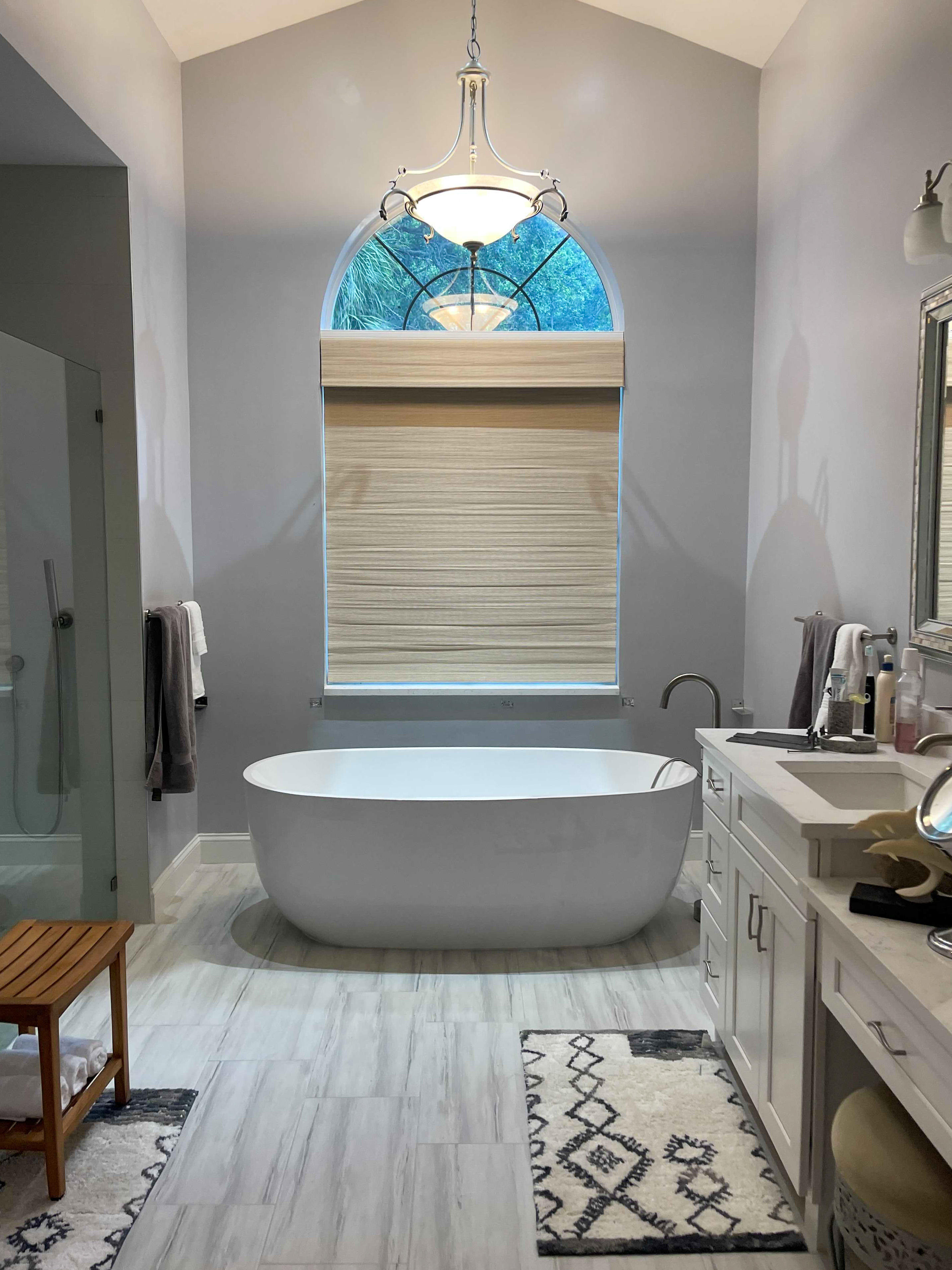 This Vero Beach bathroom was transformed into a stylish and calming space. Soft, textured shades add to the luxurious feel of this bathtub nook. Perfect for unwinding after a long week.