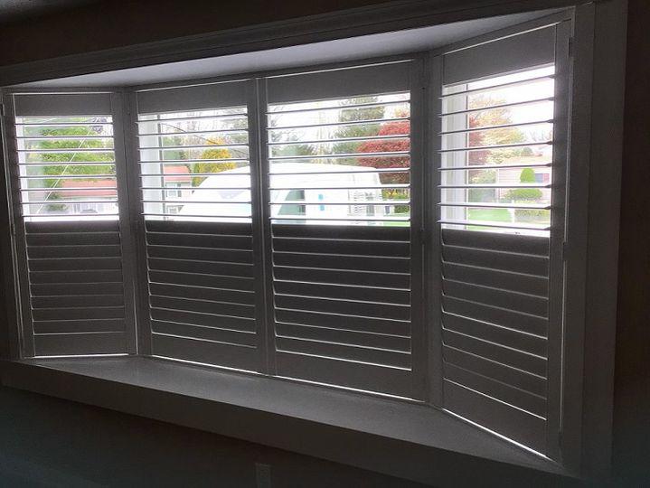 Curtains aren't always the best choice for beautiful bay windows. Here's an idea to consider! What about our Composite Shutters, as featured in this Phillipsburg home?