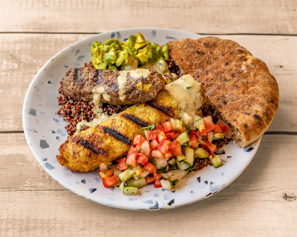 Mixed Grilled Kebab, Avocado Hummus, Israeli Salad, Tahini, 1/2 Pita
