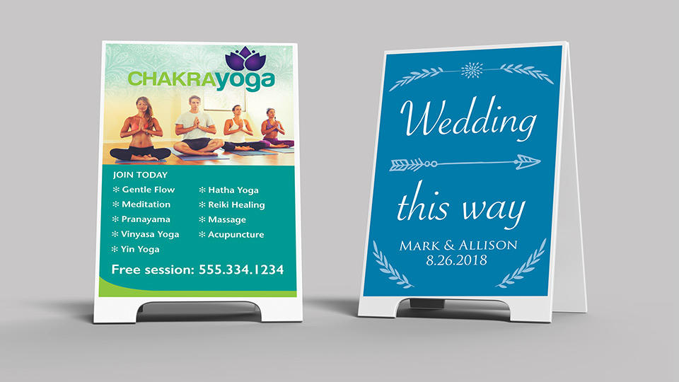 2 a-frame sidewalk signs. One has information for outdoor yoga classes, and the other says "Wedding this way"