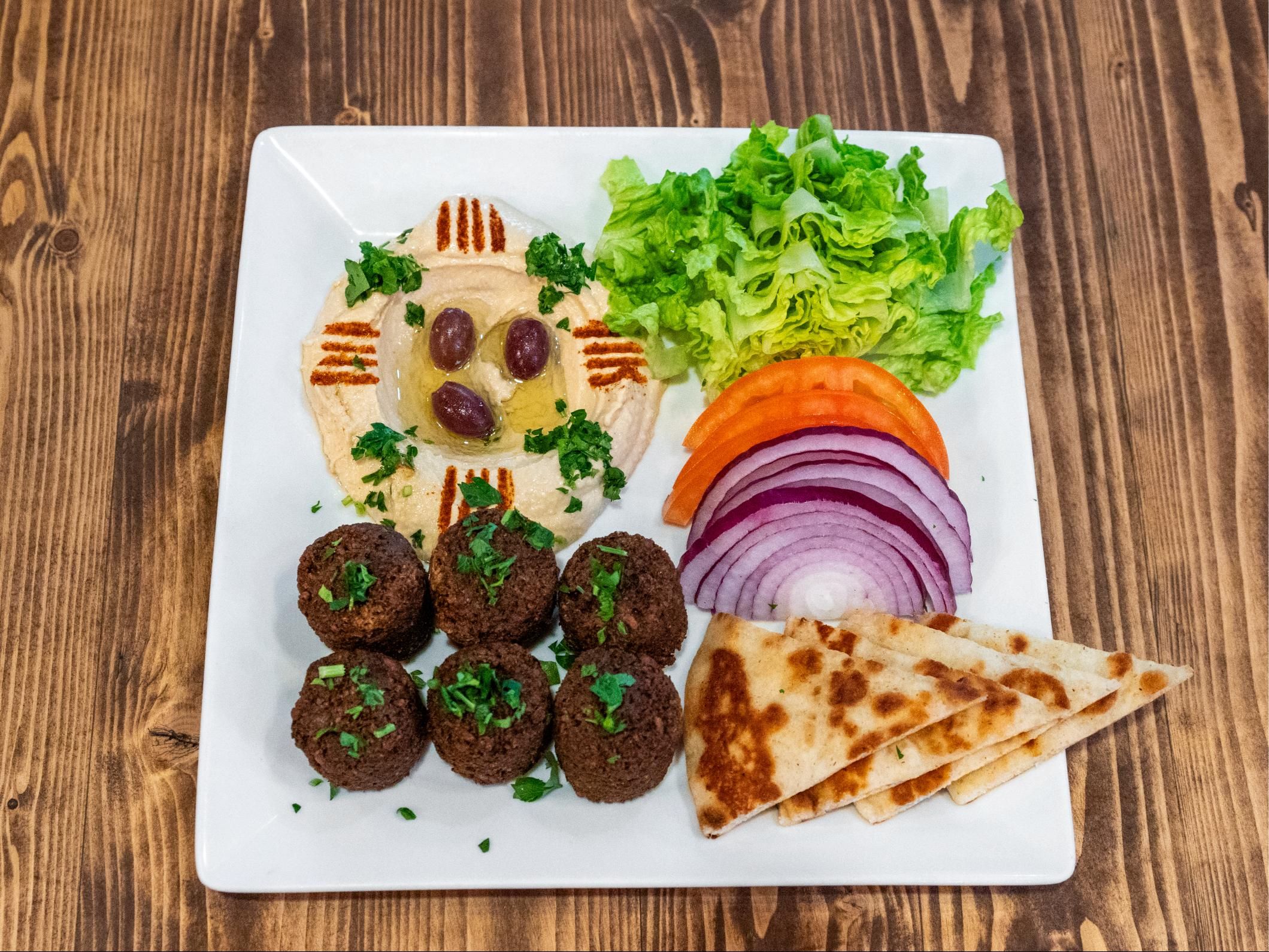 Falafel Platter With Hummus & Lettuce Tomatoes, And Onions Or With Choice Of Your 2 Sides