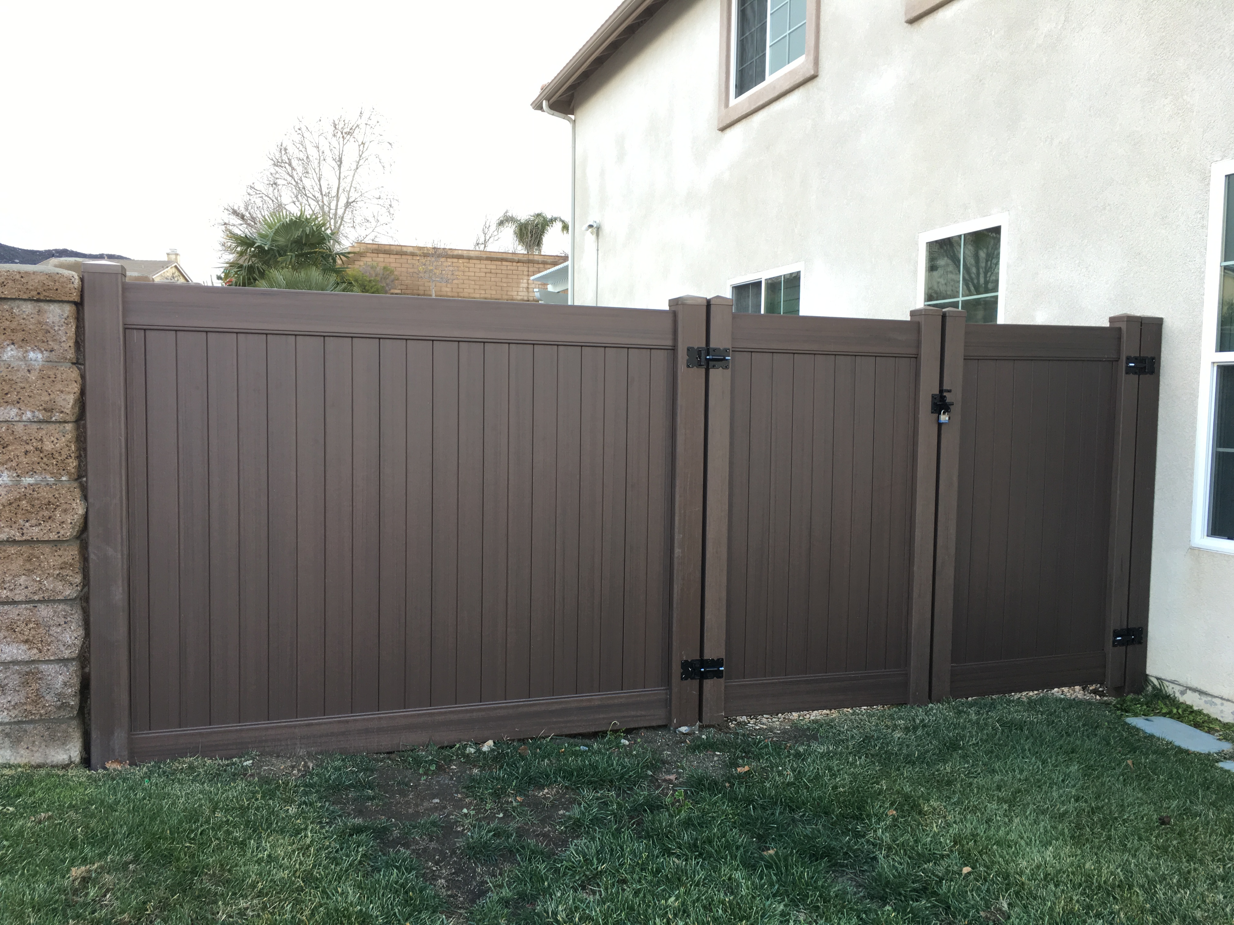 Dark Brown Vinyl Fence and double gate in Murrieta Ca.