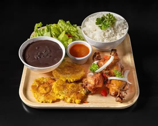 Fried Goat in Sauce (Served with Plantain and 1 Choice of White Rice, Rice and Beans, Djondjon Ri...