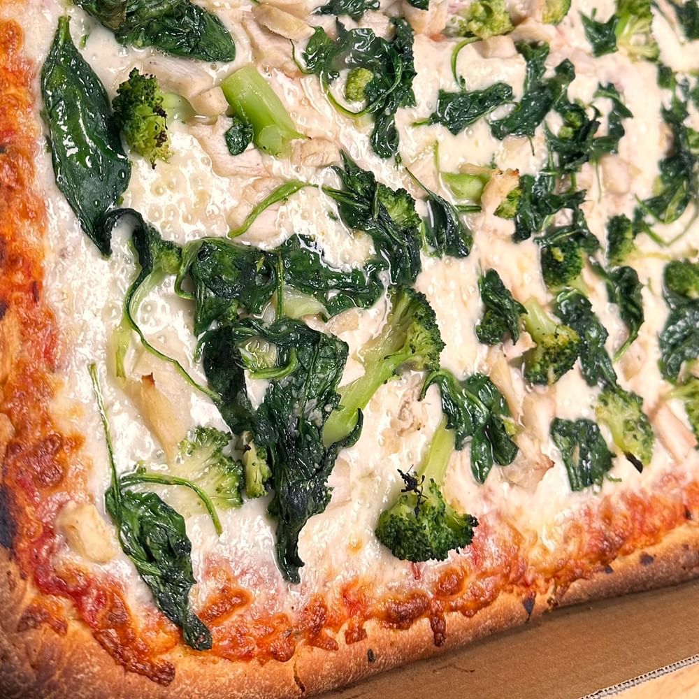 Broccoli or Spinach White Specialty Pizza