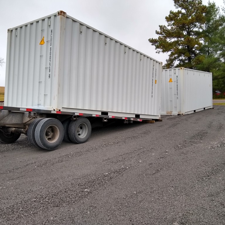 Two one trip 8x20' commercial containers delivered to our facility today. We deliver from the street by lifting then rolling them into place on your property.