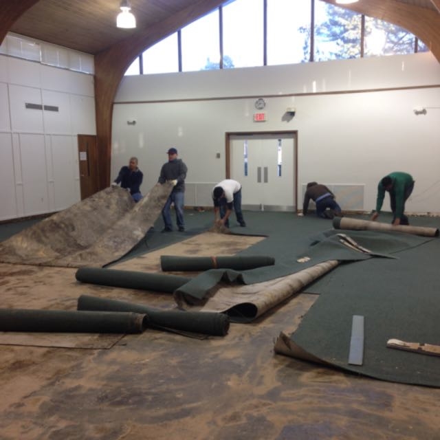 Here we are picking up the old carpet.