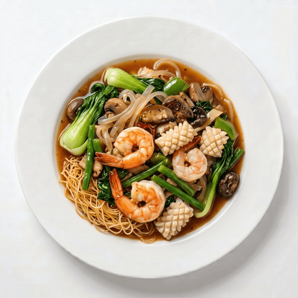Stir-Fried Shrimp, Calamari, Crab Stick, & Vegetables on Top of Egg Noodles or Rice Noodles