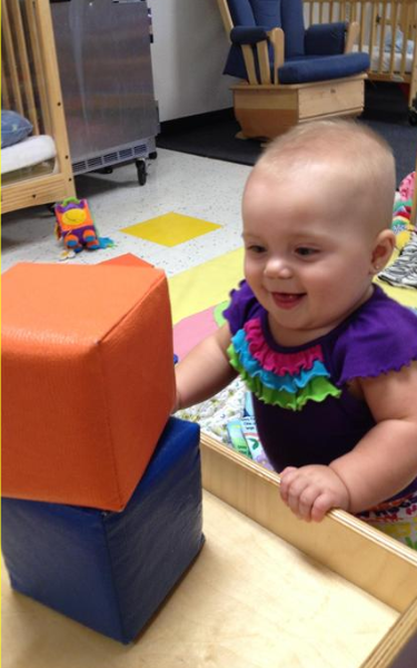 Infant Classroom - Stacking blocks on my own!
