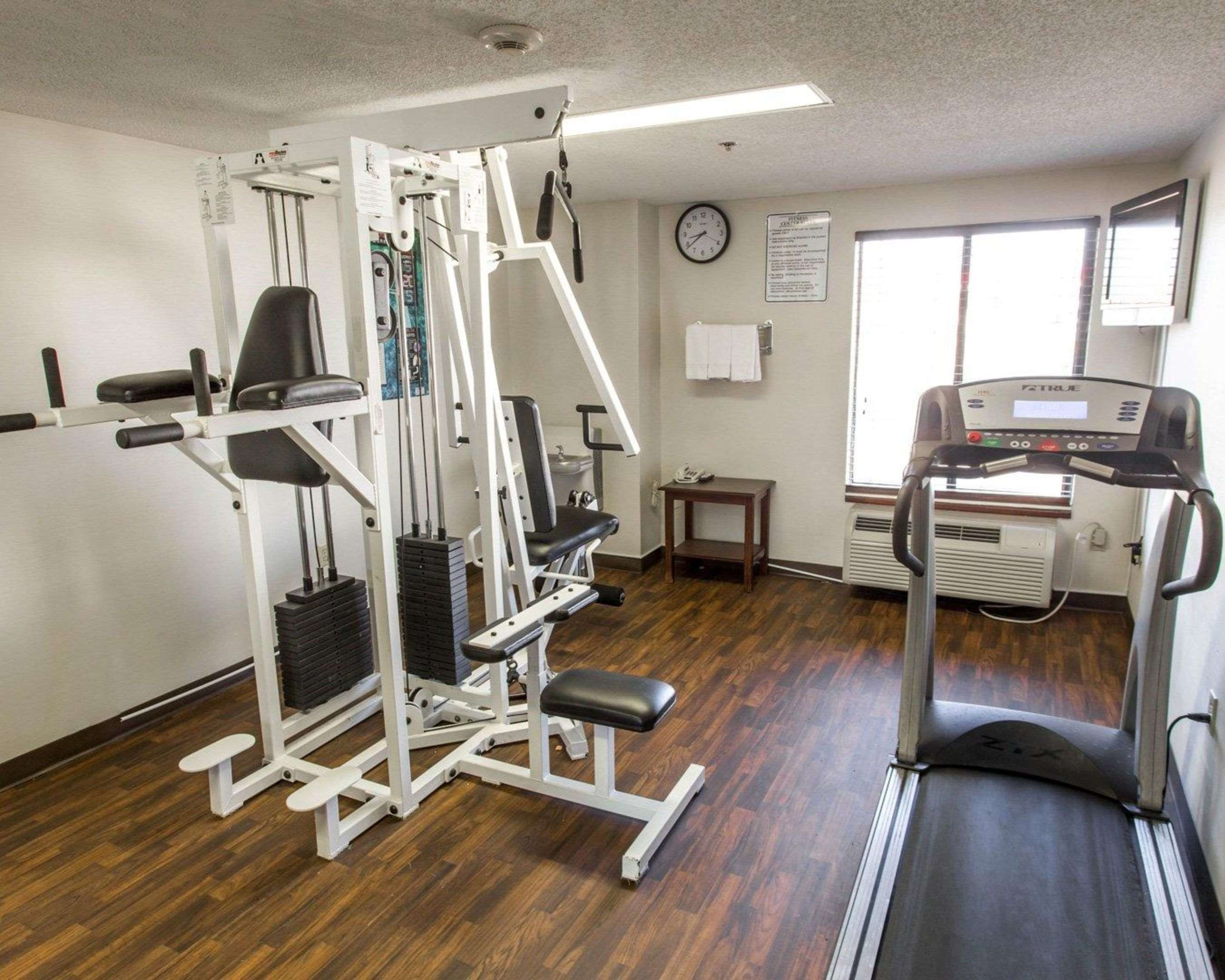 Exercise room with cardio equipment and weights