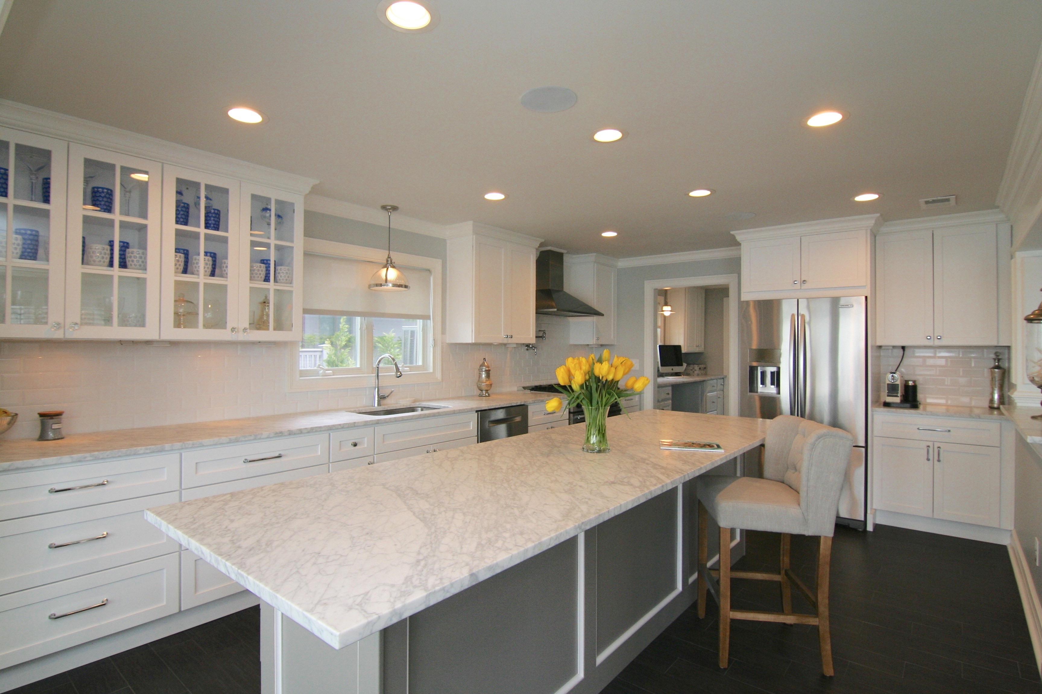 Beautiful Kitchen remodel with white cabinet and gray accents.  