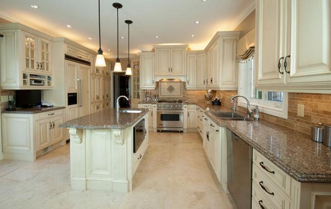 This kitchen is a culinary dream. Every cabinet, molding and panel was made custom to specification and size in order to fit the lifestyle of the Posnet family in Davie. 