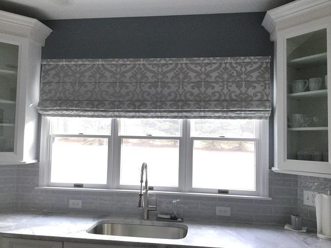 Patterned Hunter Douglas Roman Shades by Budget Blinds of Phillipsburg can bring any kitchen to life! These accent window treatments keep your kitchen cool and comfortable on bright summer days.  BudgetBlindsPhillipsburg  RomanShades  HunterDouglasShades  ShadesOfBeauty  FreeConsultation
