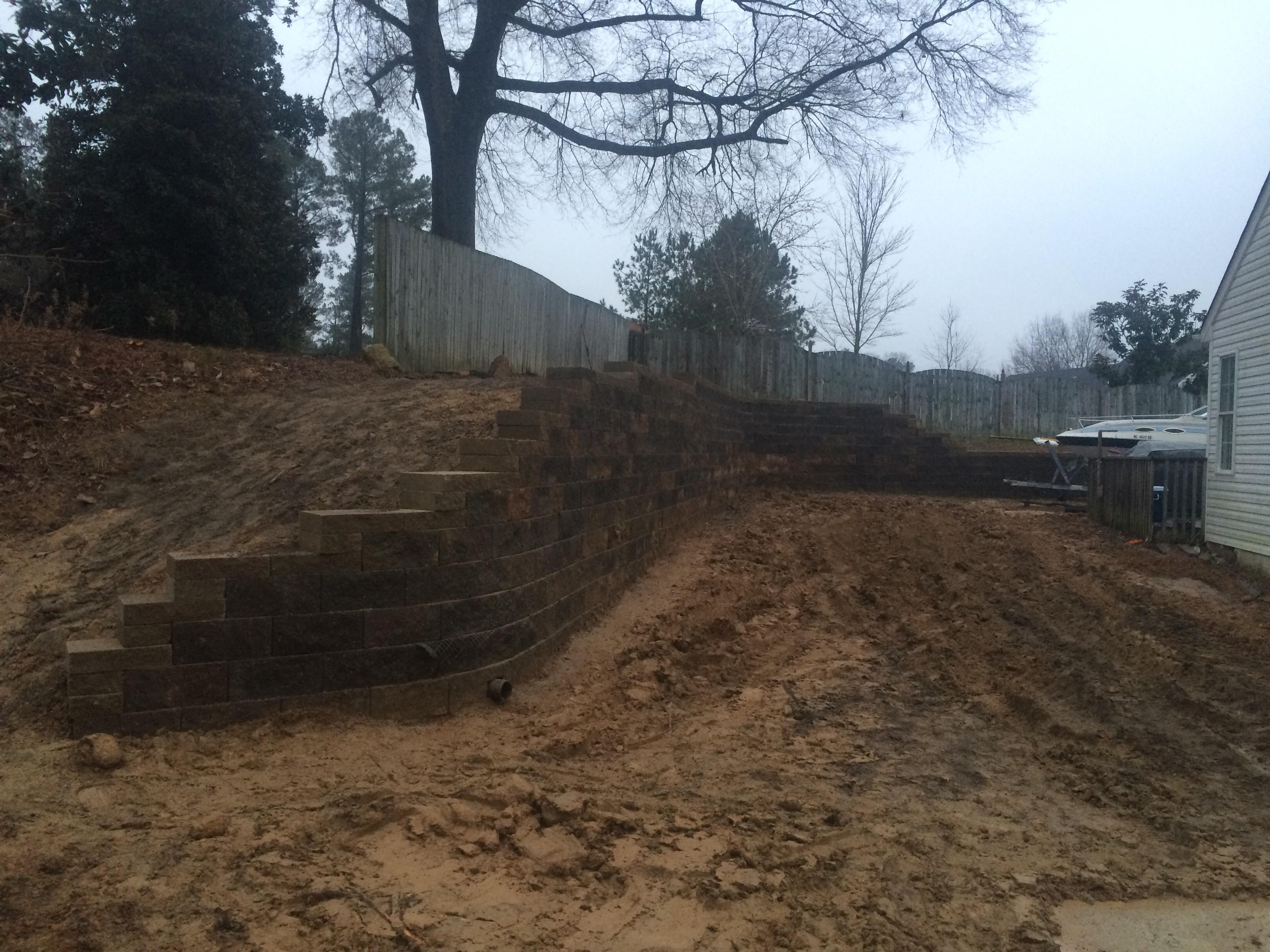 Engineered 8ft tall retaining wall built by us at Hurley Property Services