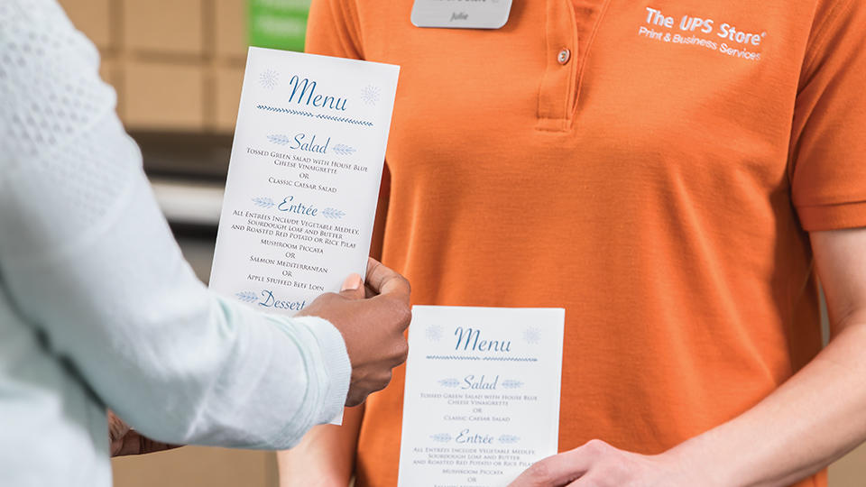 Close up of customer holding menu