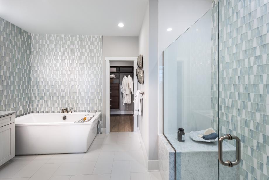 Graphic depiction: Spacious primary bathroom suites with soaking tubs and tiled showers