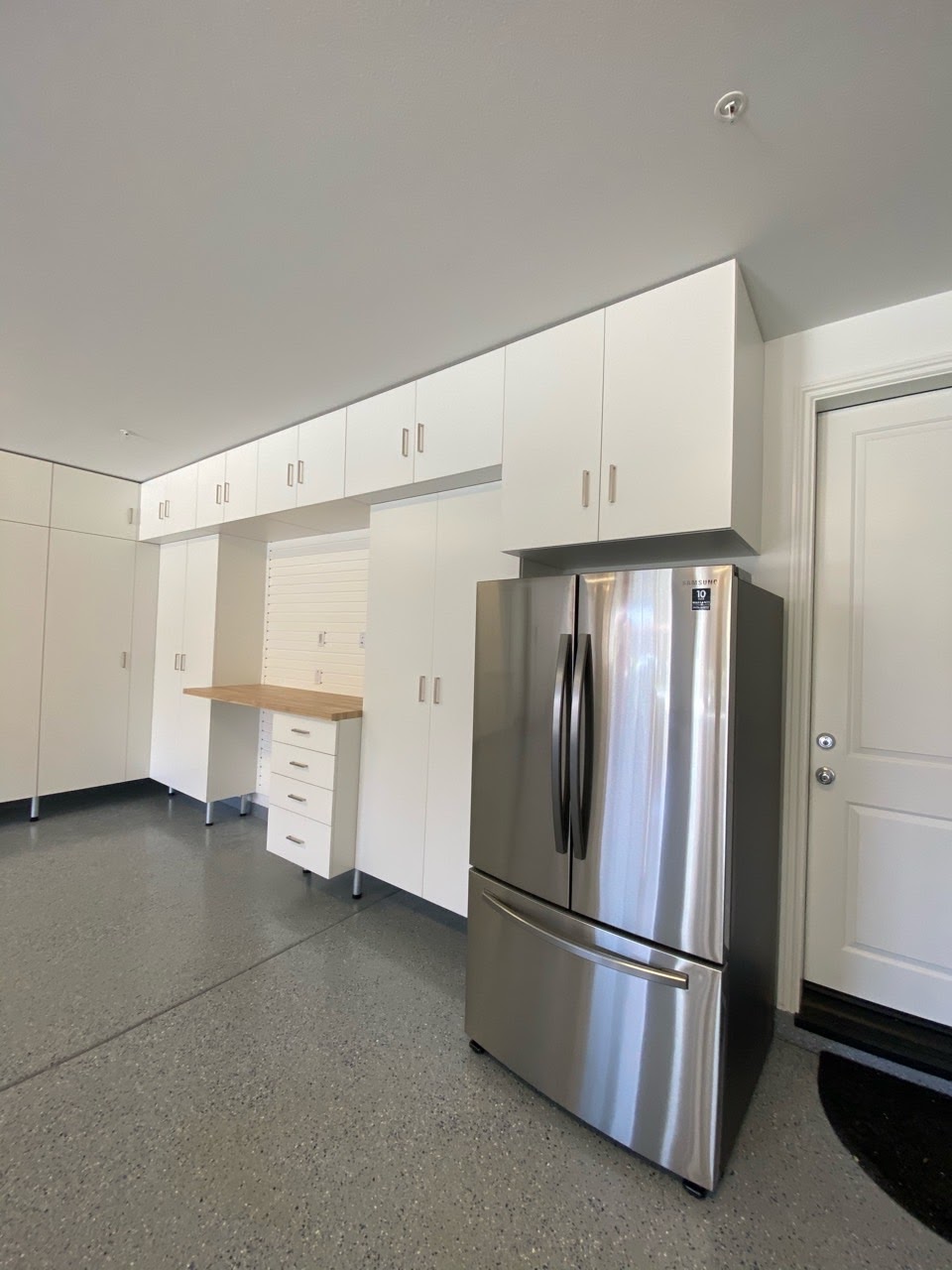 White Garage Cabinets w/ Butcher Block Countertop