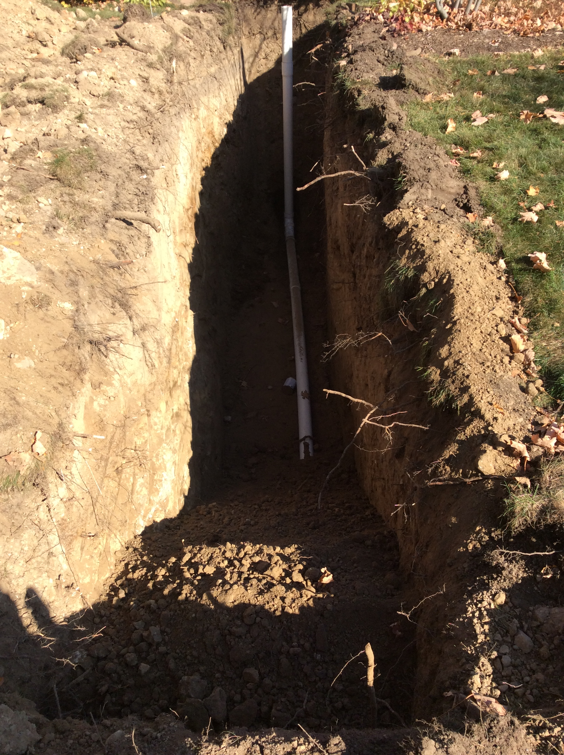 Main sewer line excavation after the new pvc pipe was installed