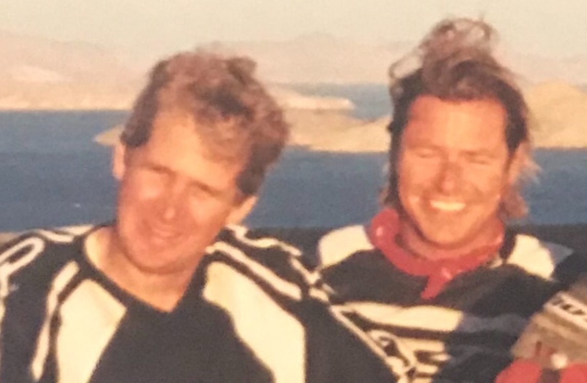 A archive photo of two friends in bike racing uniforms
