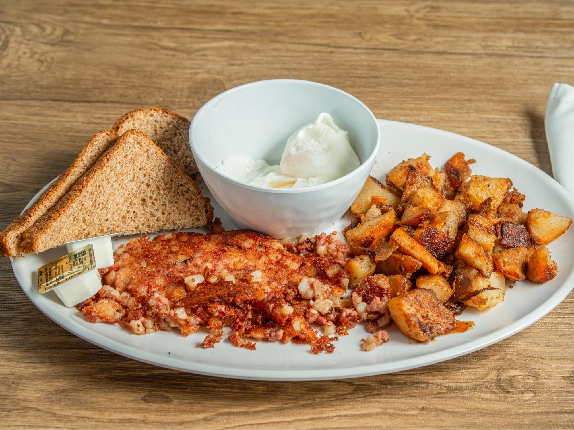 2 Eggs Your Way w/Home Fries or Beans & Choice of Toast or Biscuit