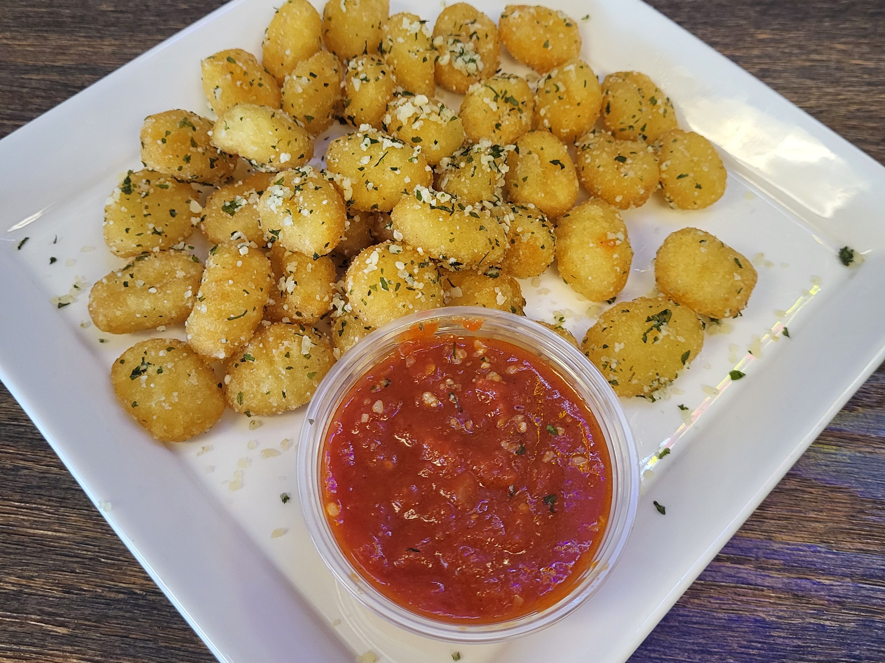 Deep Fried Cheese Filled Gnocchi With A Side Of Marinara