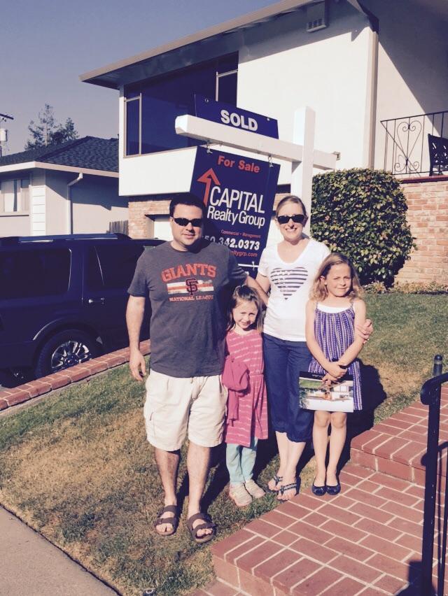 Happy clients on purchase of new home!