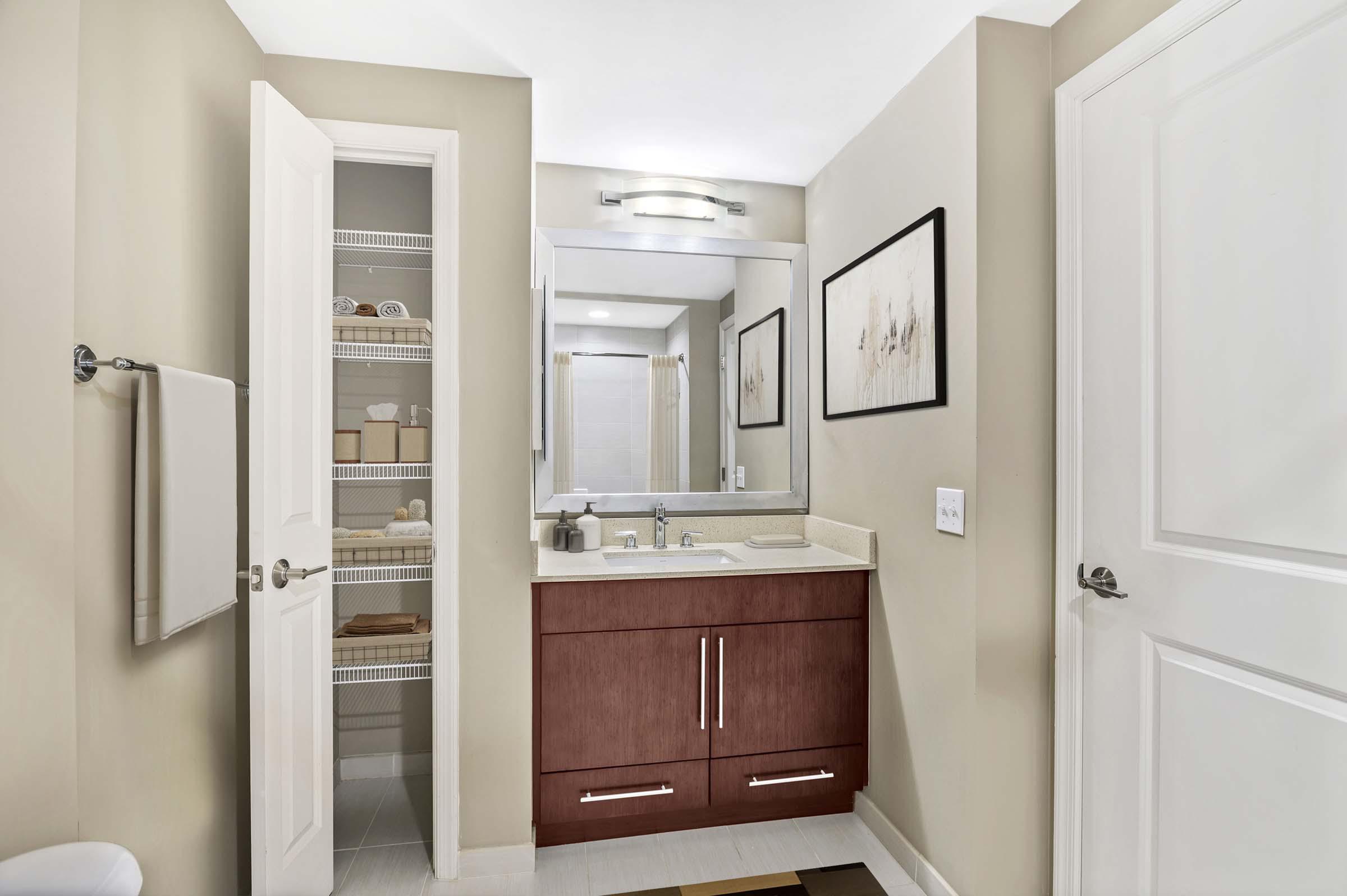 Cherry wood design scope bathroom with linen closet