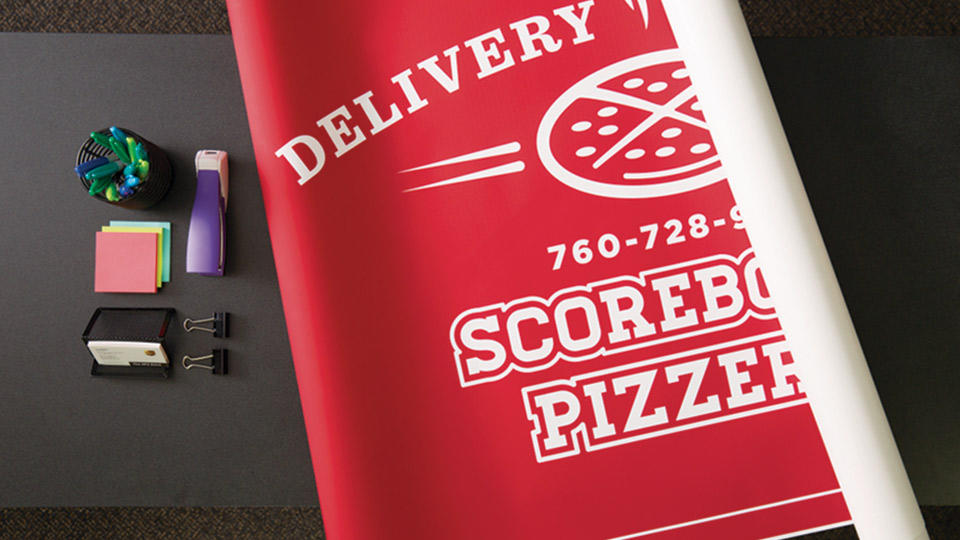 A printed banner for a Pizza restaurant