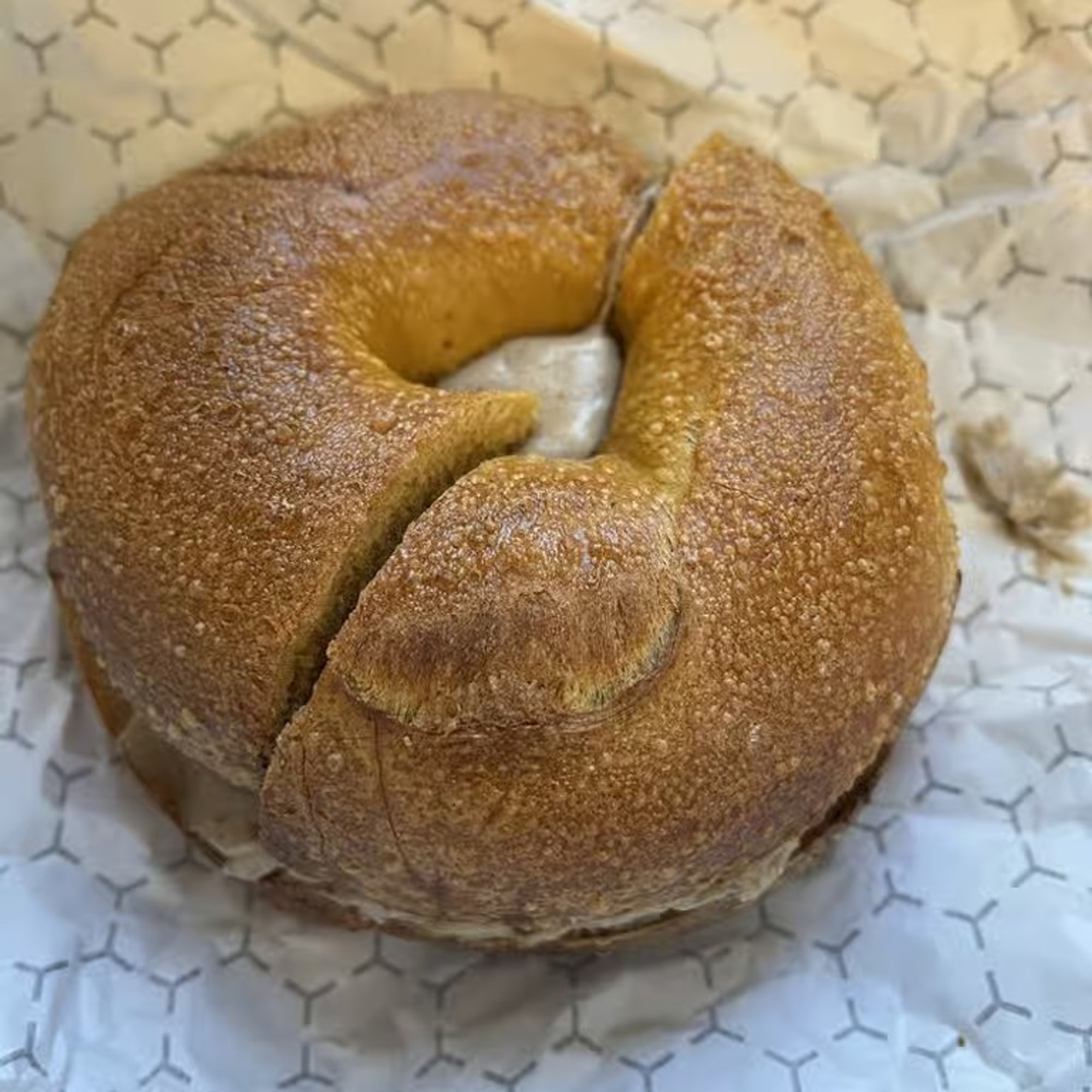 A bagel with maple walnut spread