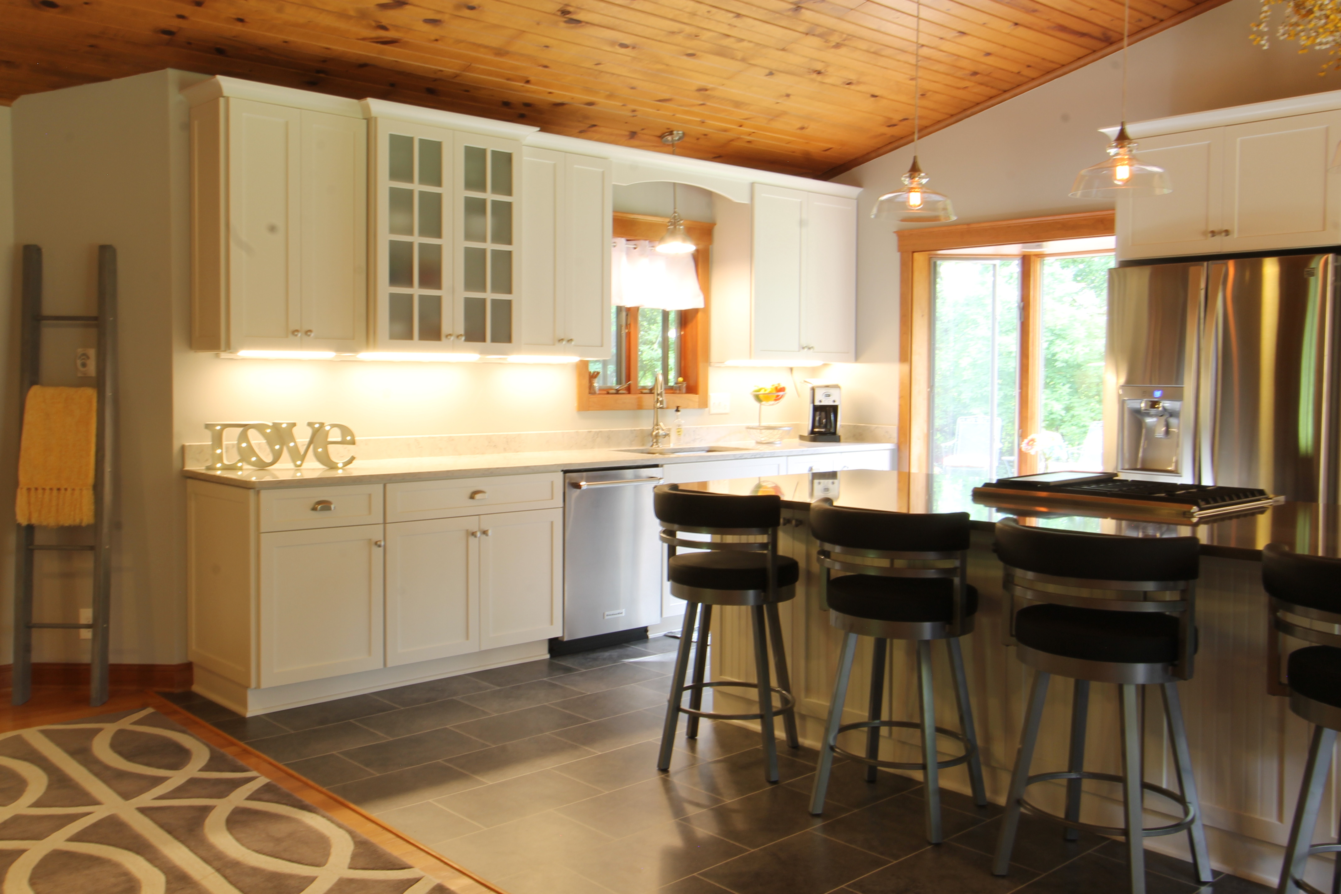 White cabinets with warm wood tones creates an elegant look.