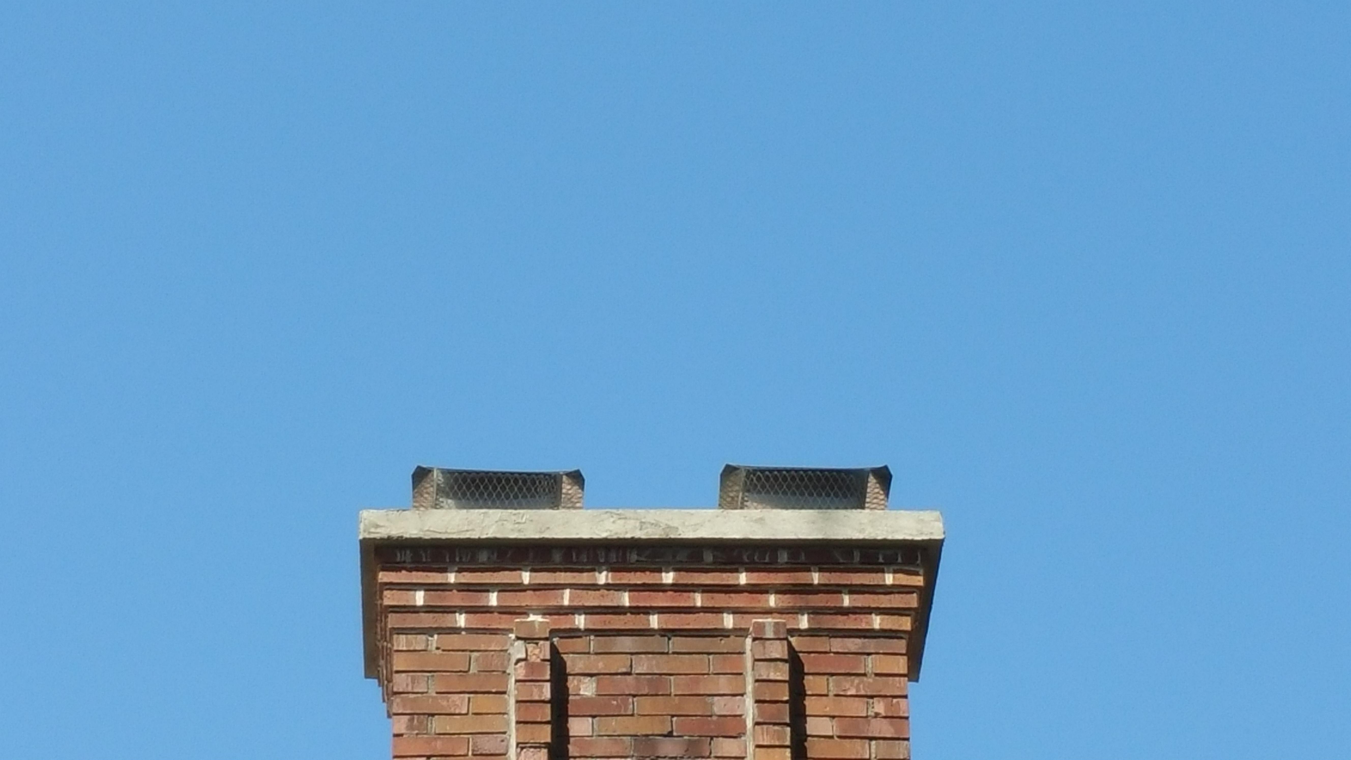 We removed top 6 courses and replaced 4 and added a crown with 2 stainless steel chimney caps