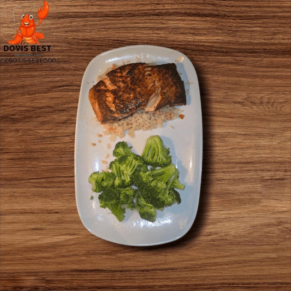 Grilled Salmon with Jollof Rice, Sauteed Broccoli, Collard Green or Spinach