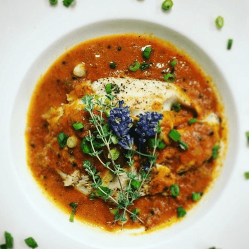 Tilapia Fish in Nigella Seed Curry Served with Rice and Classic Naan