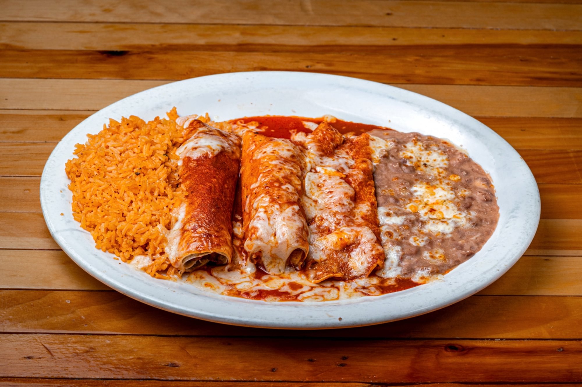 4. Enchilada, Burrito, and Tamal Combo