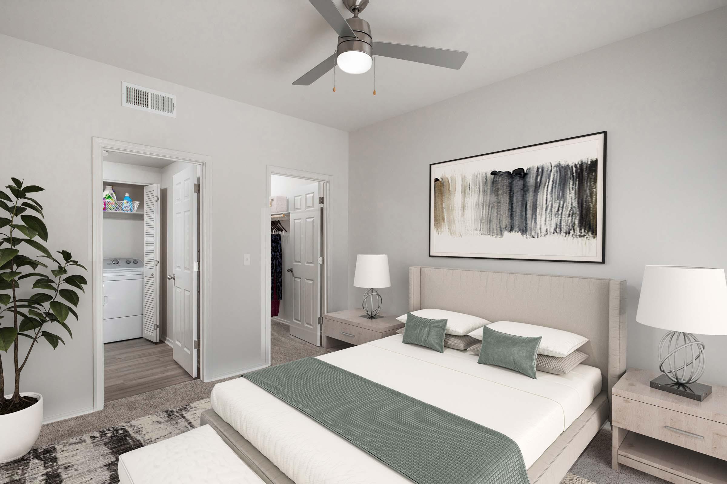 Main bedroom with ensuite walk-in closet and ceiling fan